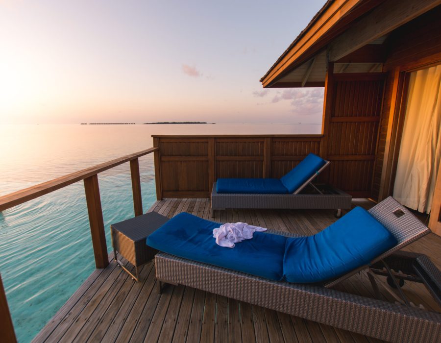 Beautiful tropical Maldives resort hotel and island with beach and sea on sky sunset for holiday vacation background concept - Boost up color Processing.